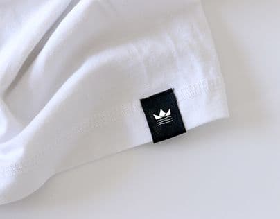 Woven crown logo label on a t-shirt
